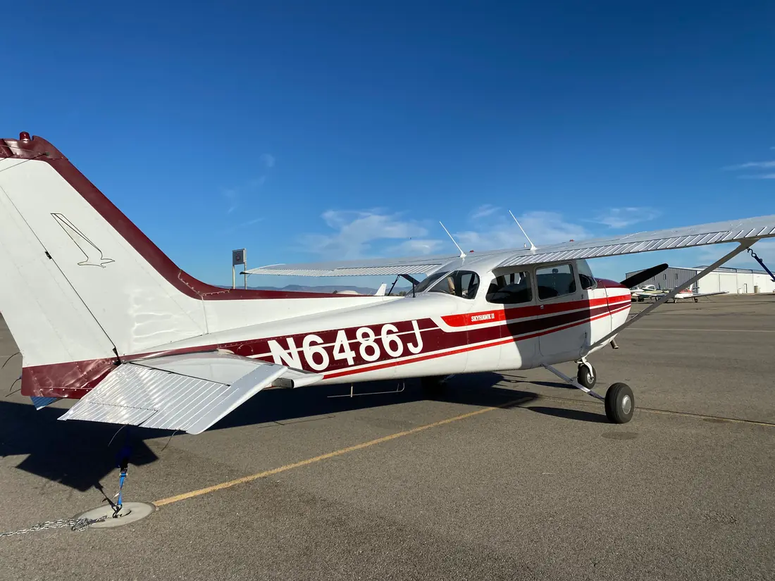 Cessna 172 N6486J on the ramp under a blue sky