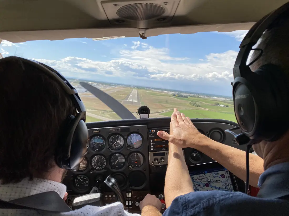 Carl Spredemann coaching a student through a crosswind approach from the right seat