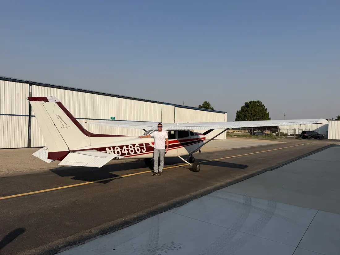 Benjamin Button next to Cessna 172 N6486J after his first solo